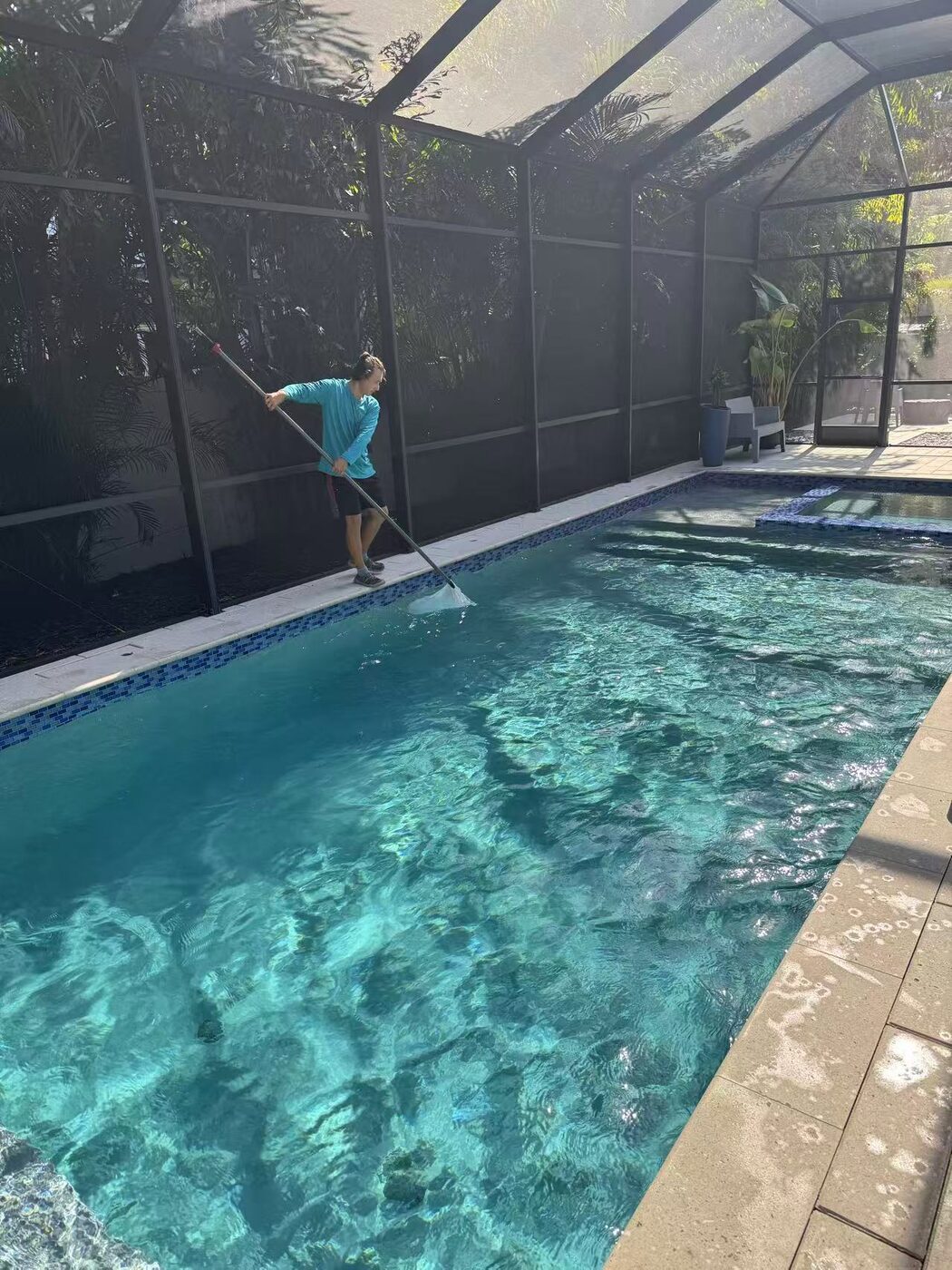 Screened pool enclosure serviced by Florida Floyd Pool Services in Tampa